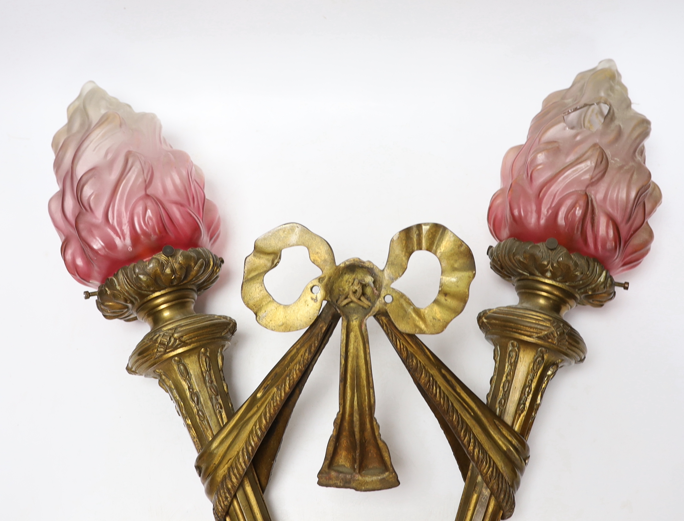 A Louis XVI style bronze double torch wall light with ‘flame’ glass shades, 63cm